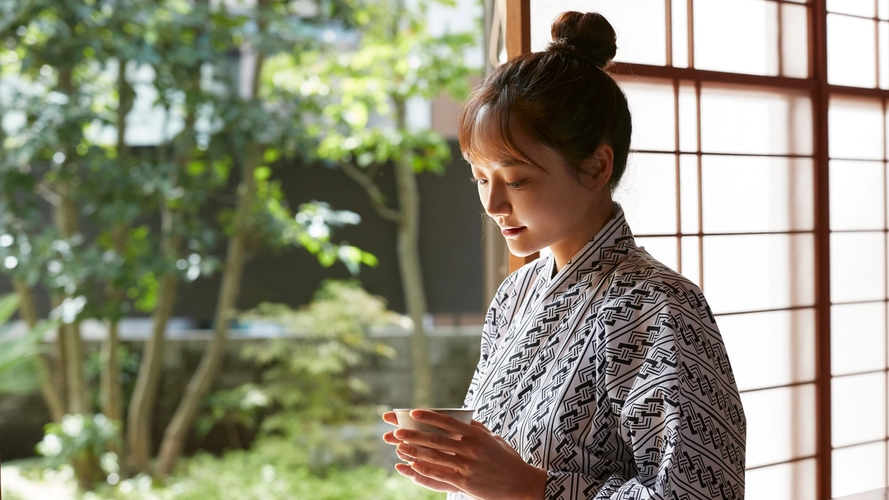 A young Asian woman is relaxing at Japanese traditional inn