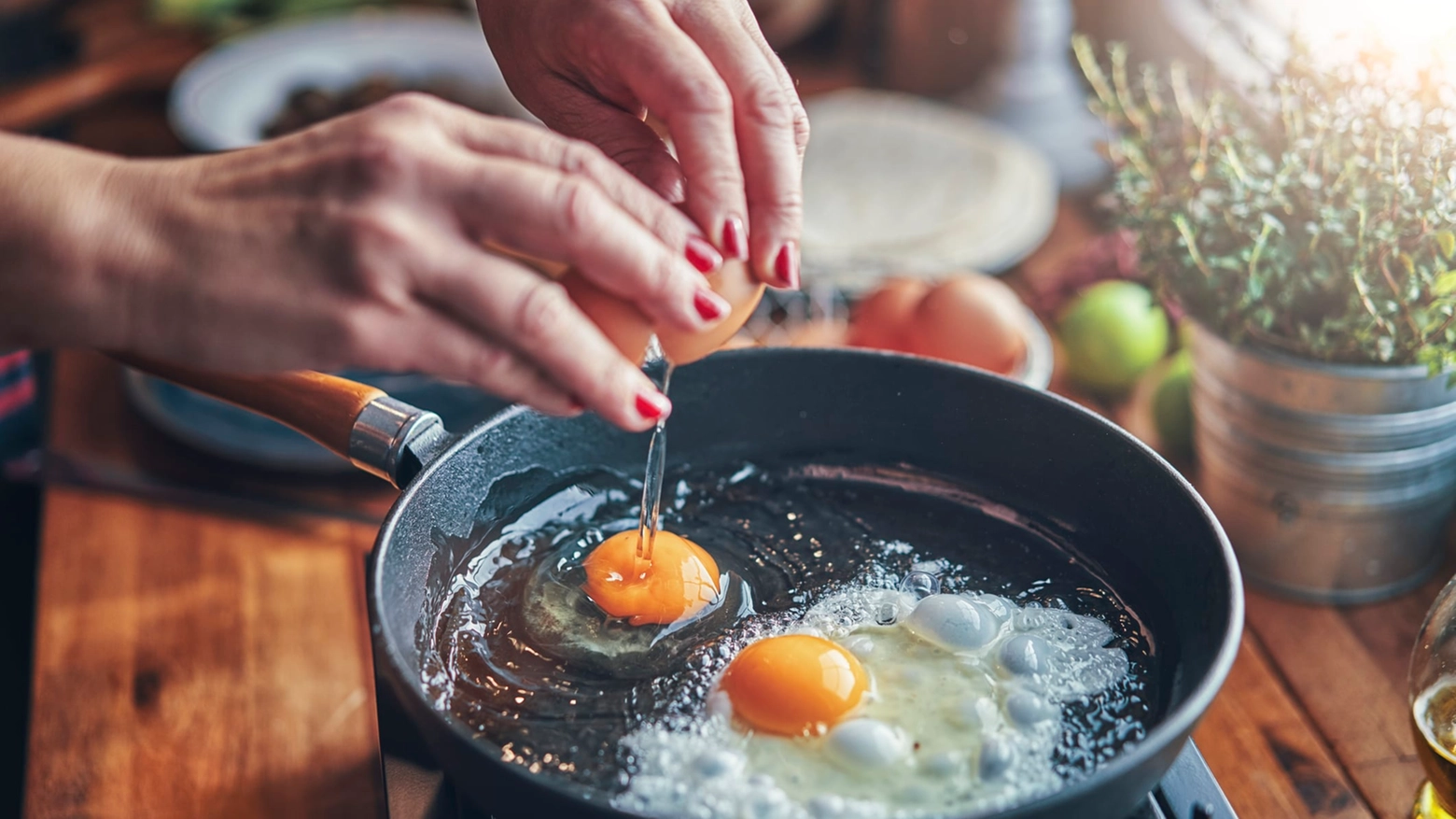 Frying Egg in a Cooking Pan in Domestic Kitchen