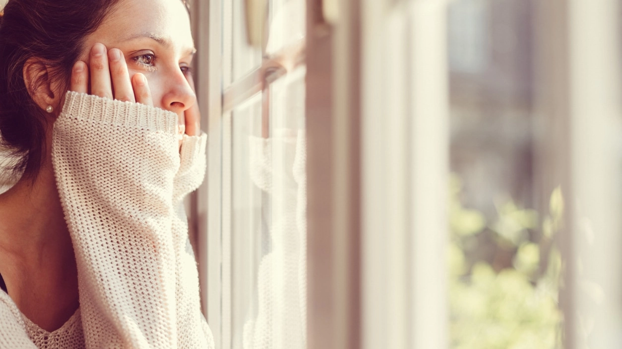 Girl looking through the window