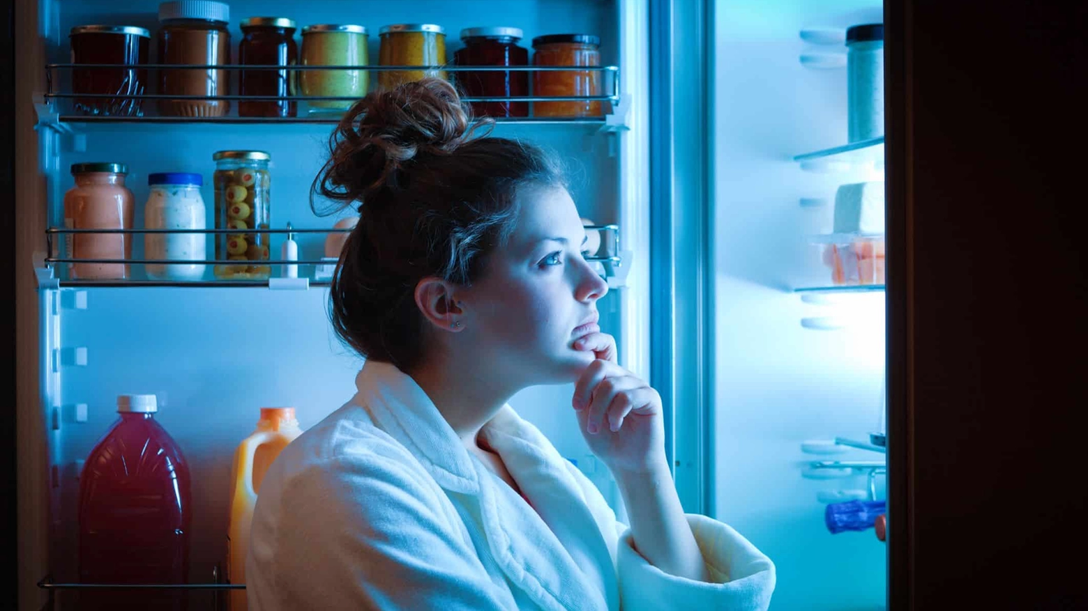 Dieting Young Woman Late Night Making Choices on What to Eat