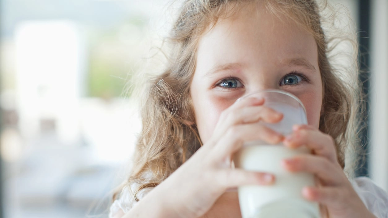 Girl drinking glass of milk