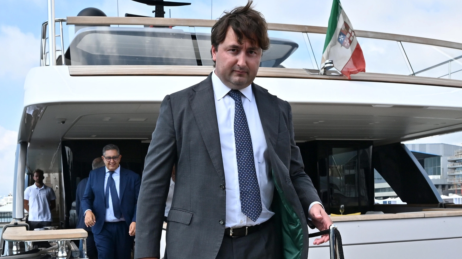 Matteo Cozzani, scende dallo yacht di Aldo Spinelli, in una foto d'archivio (Ansa)