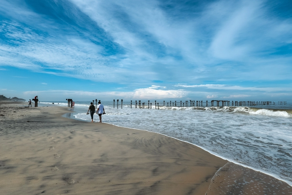 Old pier ruins extends to the sea beach view from the Venice of the East Alappuzha Kerala India. Famous destination of backwaters in Kerala top tourist places in Kerala.