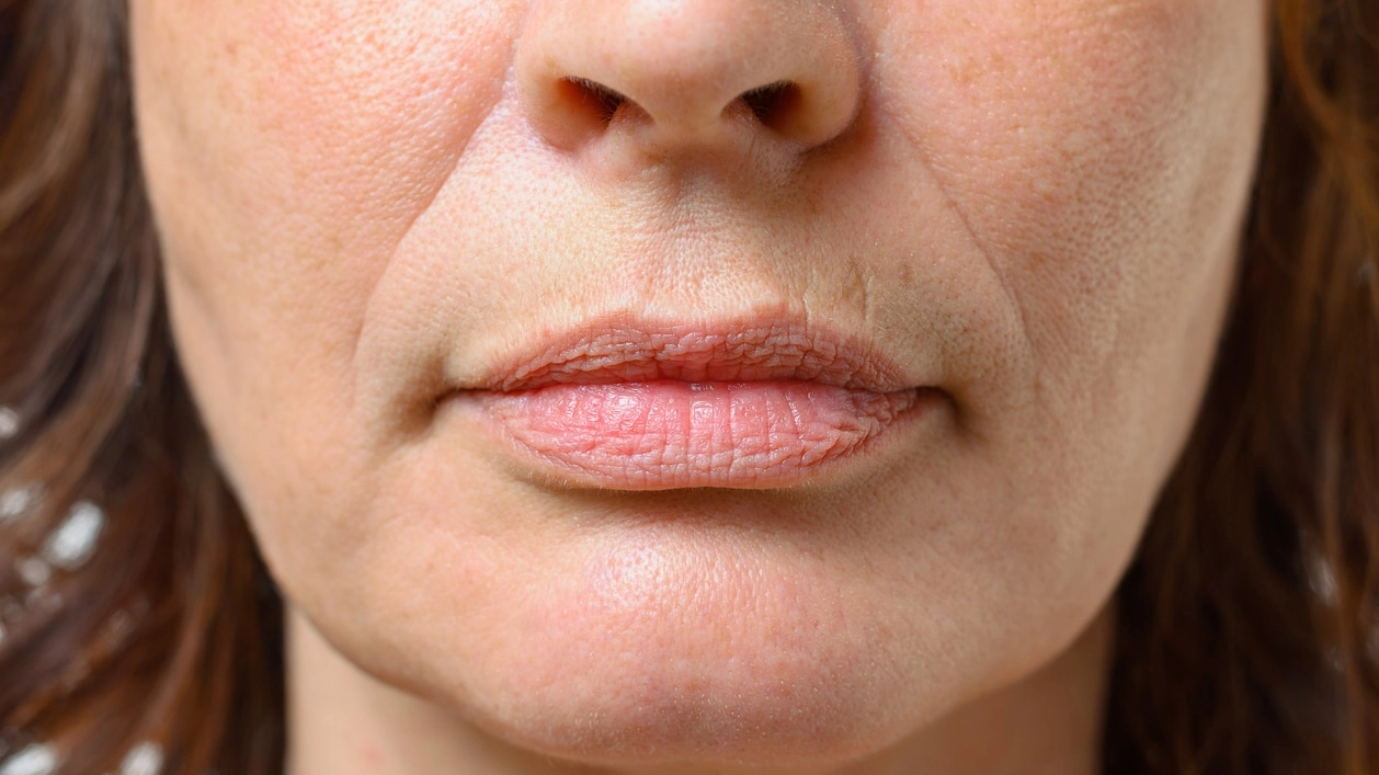 Closeup on the mouth of a middle-aged woman