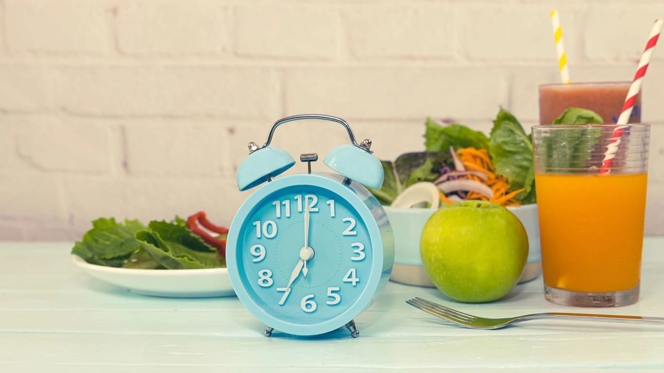 Selective focus Alarm of blue clock which the Concept of intermittent fasting, breakfast time with a diet and weight loss - Image