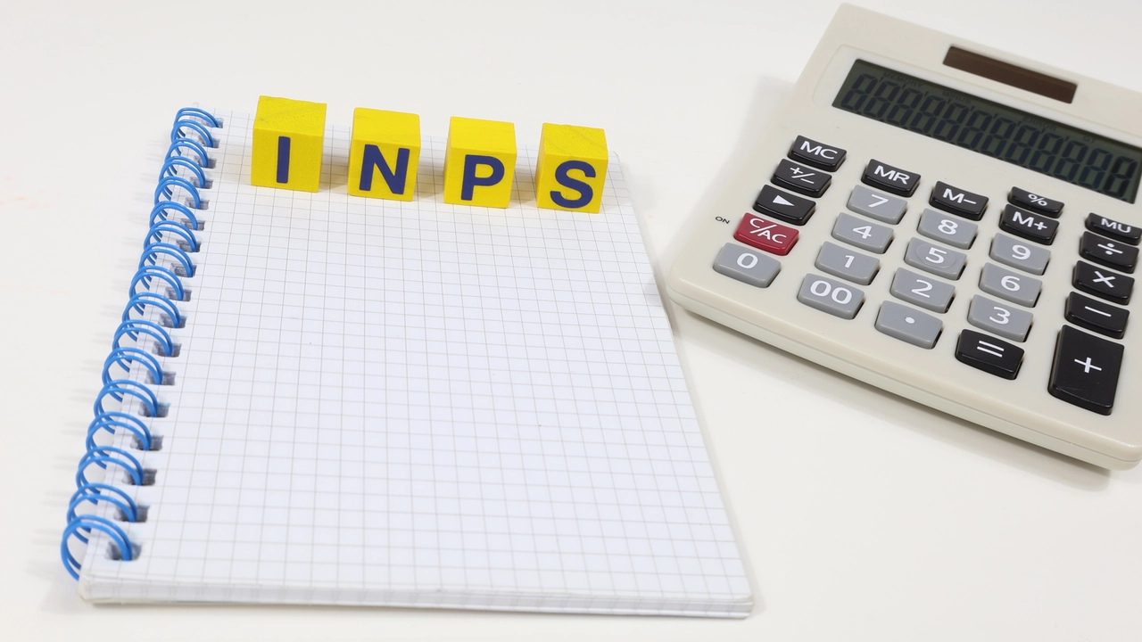 Single Word INPS On Wooden Block. Taxes on the concept, Italian government reform. Notebook on the table.