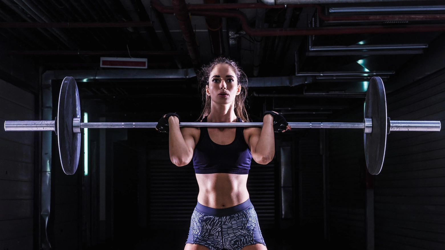 Woman Lifting Weights in Gym